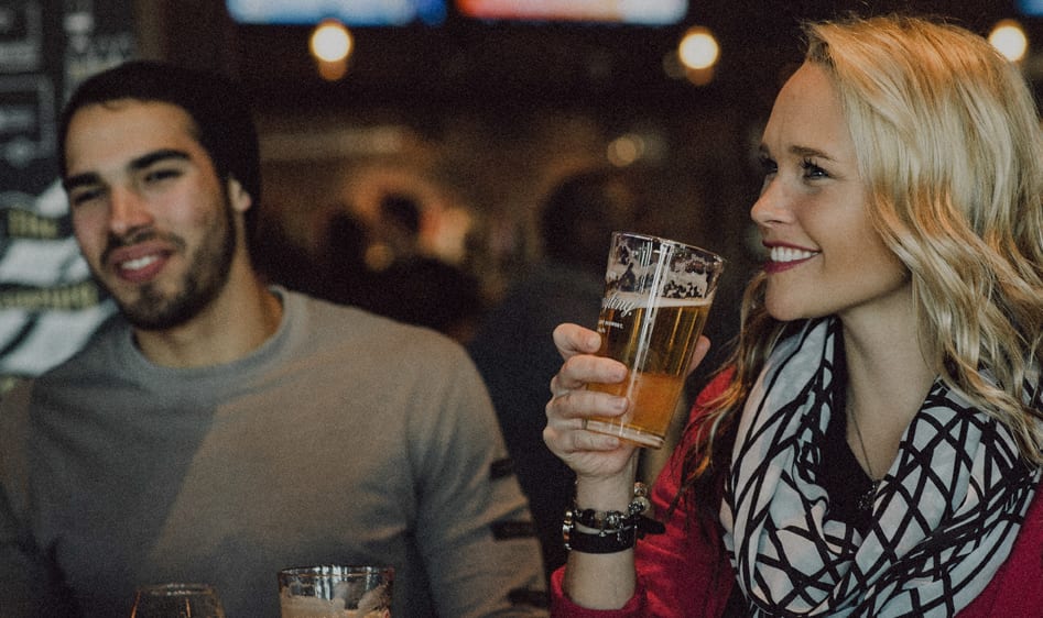 Man and woman enjoying a drink.