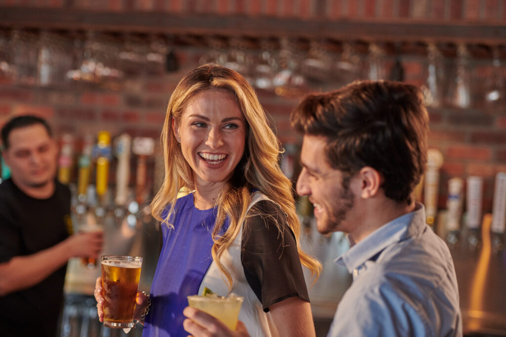 Guests enjoying drinks at the World of Beer Bar & Kitchen bar.